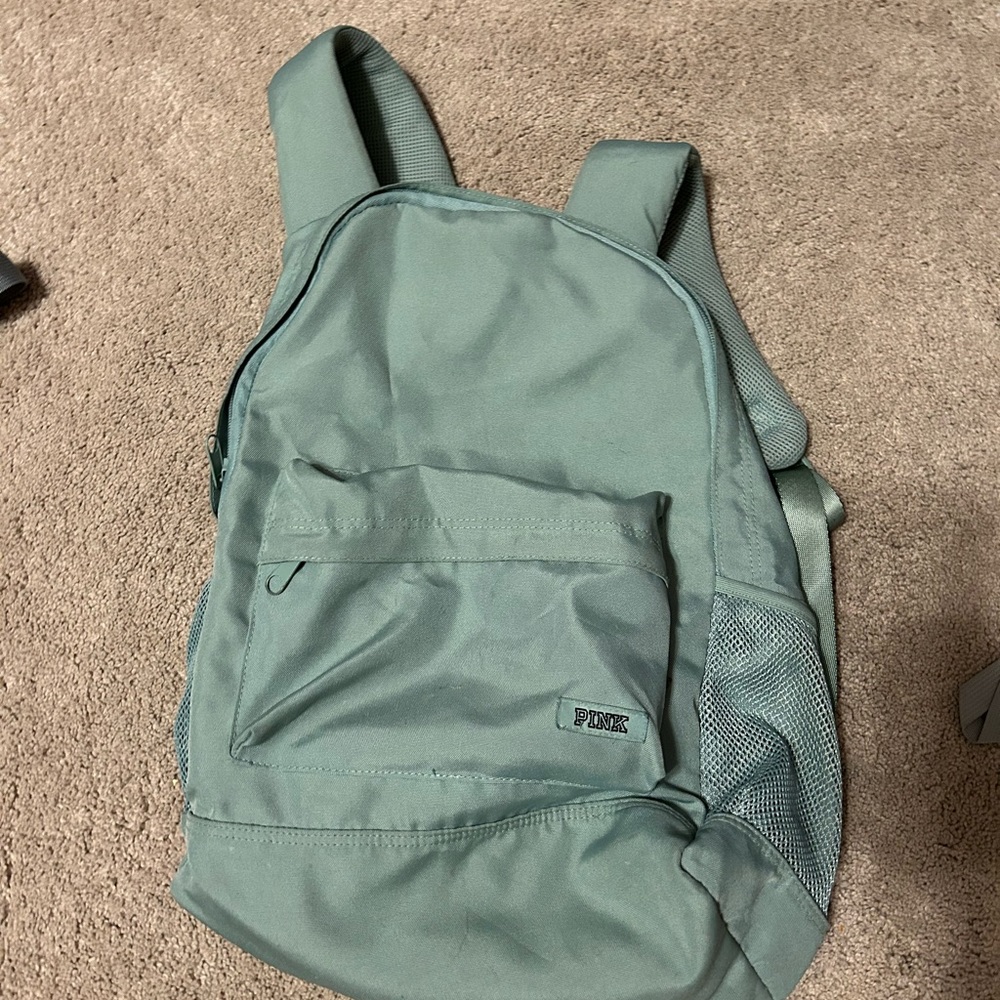 Pink brand green backpack